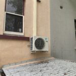 Daikin condenser unit on wall brackets at Annandale