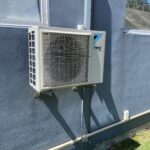 Old ac outdoor unit on wall brackets at stanmore